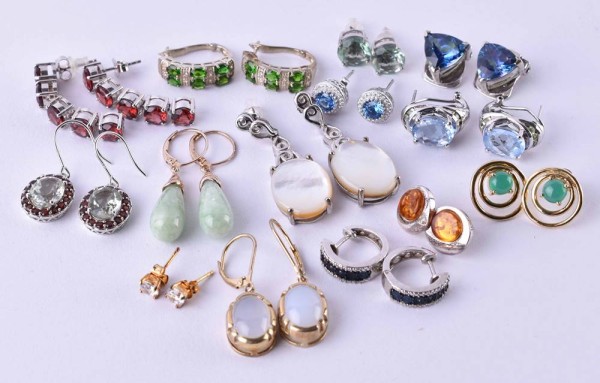 A group of earrings