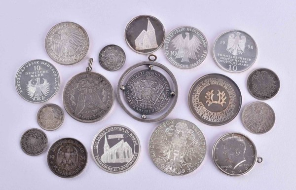 A group of silver coins and medals