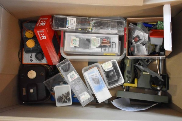 A group of model railway accessories and tools