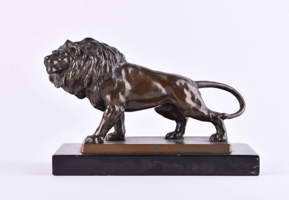 Animal figure striding lion